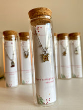 Load image into Gallery viewer, Pulseras navideñas en tubitos de cristal
